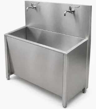 surgical scrub station with pedal operated
